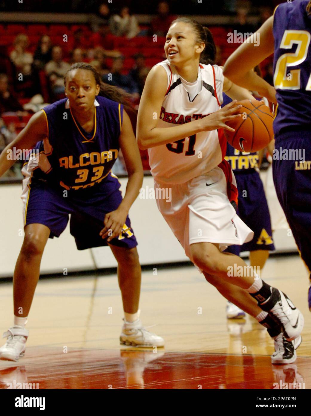 Texas Tech's Ashlee Roberson (31) drives the lane in front of Alcorn  State's Kirara Seldon (33) in the first half of a women's college  basketball game, Saturday, Nov. 24, 2007, in Lubbock,