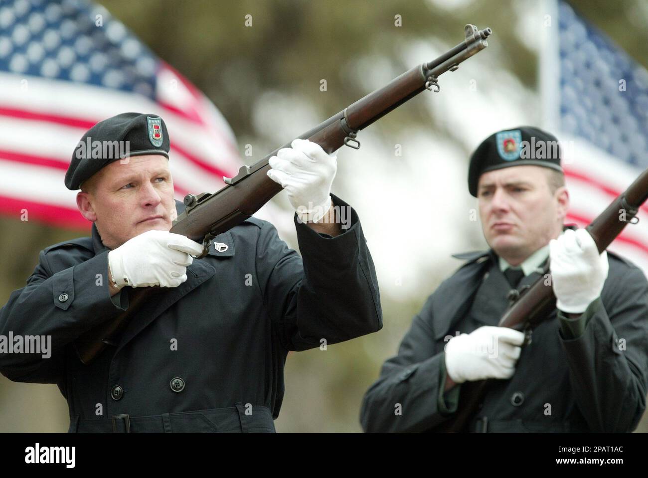 A honor guard prepares to fire a volley over the casket of U.S.Army Sgt