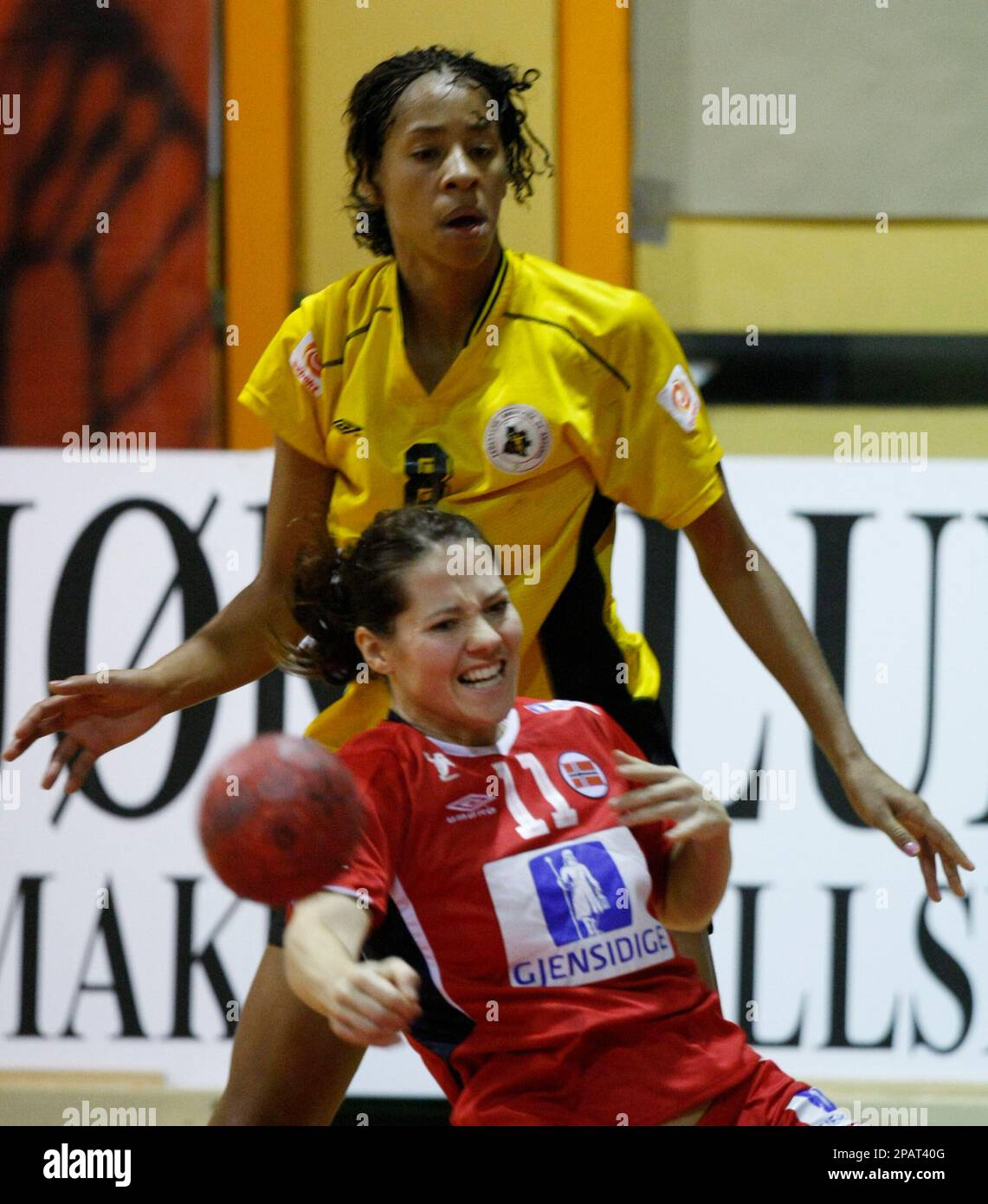 Angola's Nair Almeida and Norway's Kari Mette Johansen, front, fight for  the ball during their teams' match in the Mobelringen Cup in Sandefjord,  Norway Friday Nov. 23, 2007. (AP Photo/Morten Holm, Scanpix) **