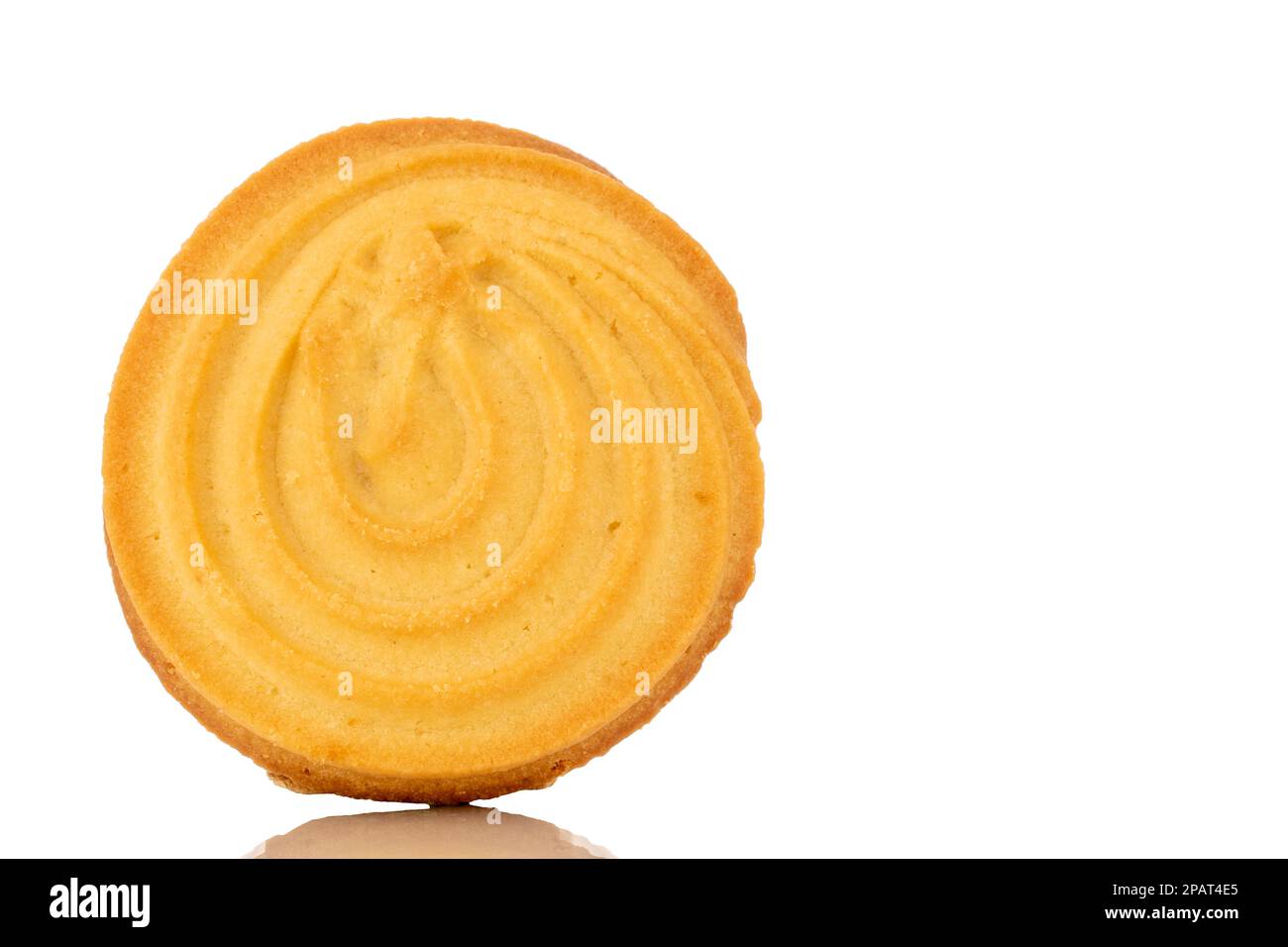 One sweet cookie with butter, macro, isolated on white background. Stock Photo