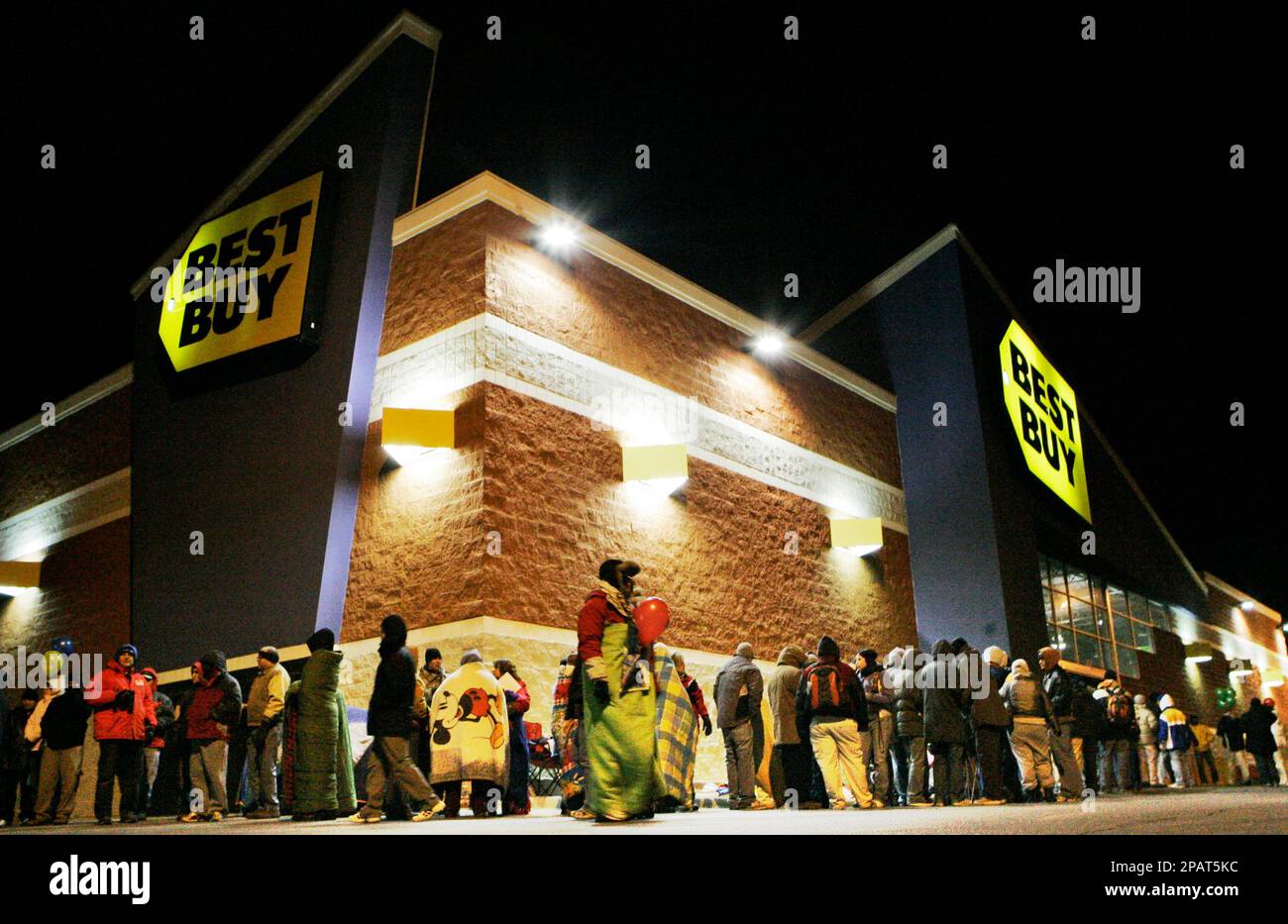 Shoppers line up for a 500 am opening of a Best Buy store in Lawrence