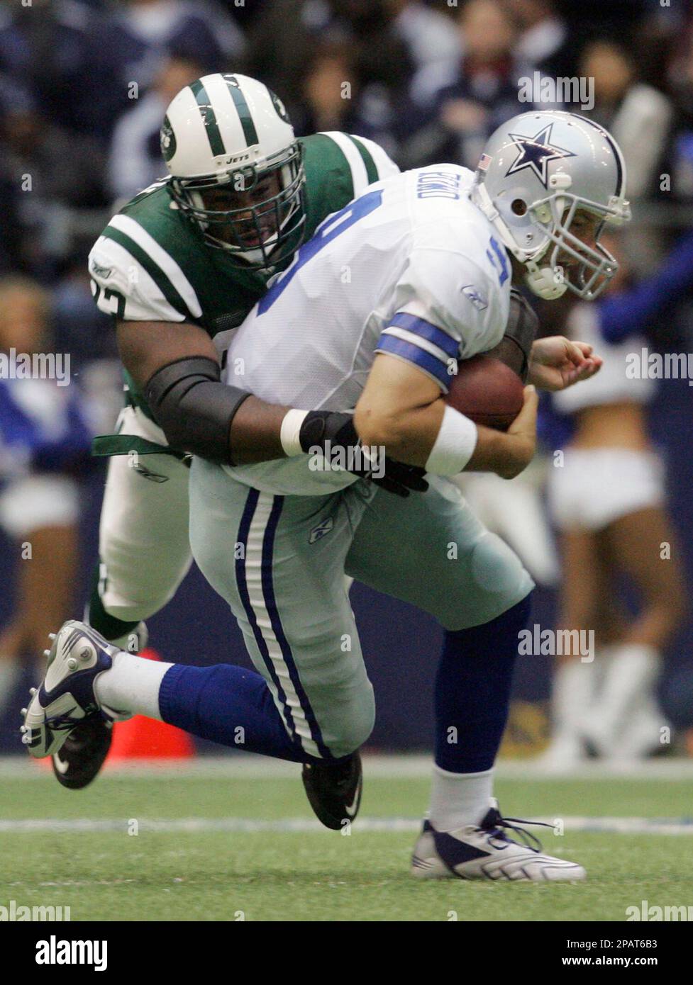 New York Jets Kenyon Coleman dives for Miami Dolphins Ronnie Brown who runs  for 43 yards after a reception in the first quarter at Giants Stadium in  East Rutherford, New Jersey on