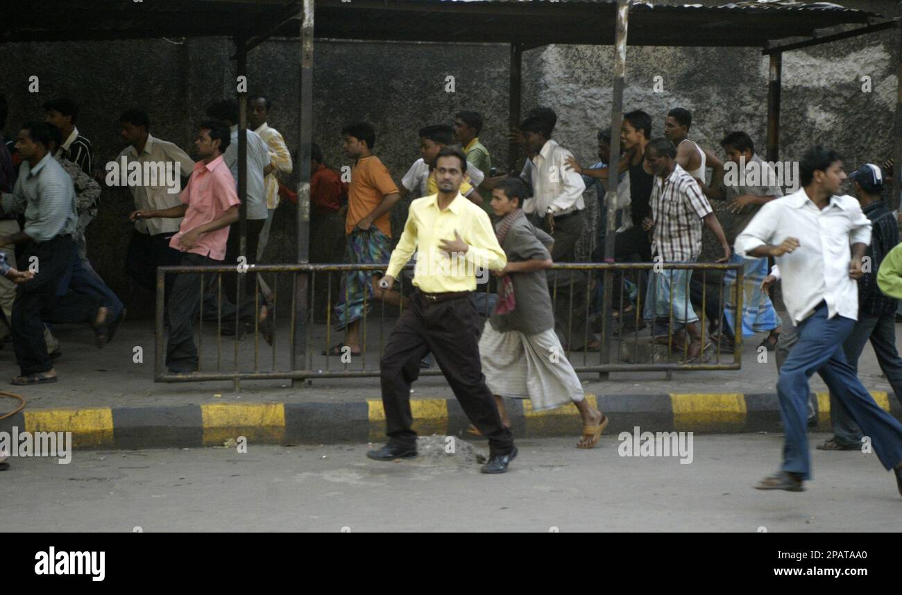 People run after violence erupted during a protest in Calcutta, India