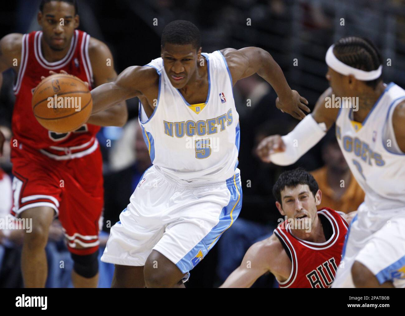Denver Nuggets forward Yakhouba Diawara, second from left, of France, picks  up a loose ball as Chicago Bulls guards Thomas Gardner, far left, and Kirk  Hinrich, third from left, look on while