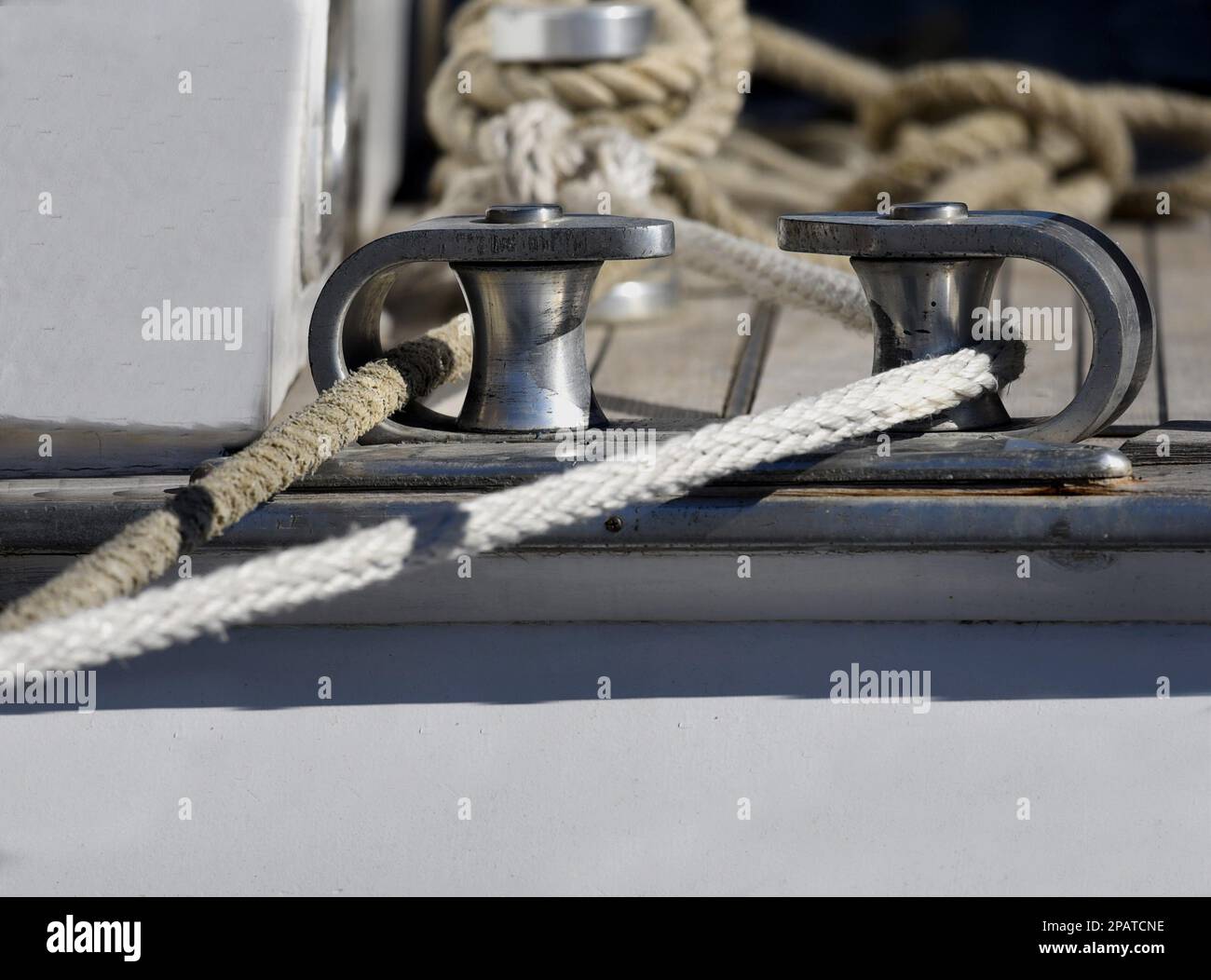Sailing boat closeup inox anchor rope hole detail Stock Photo Alamy