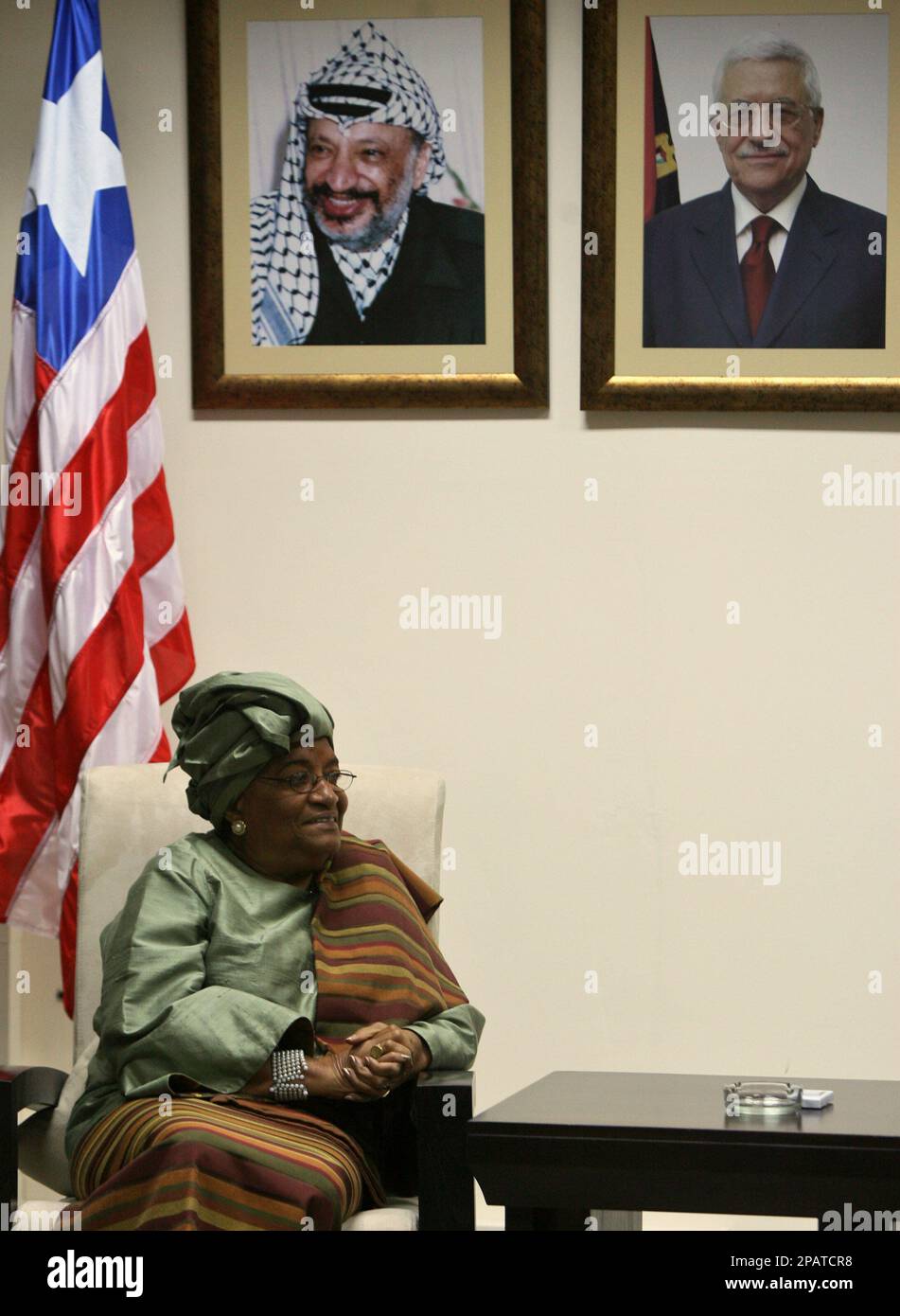 Liberian President Ellen Johnson-Sirleaf is seen sitting under the ...