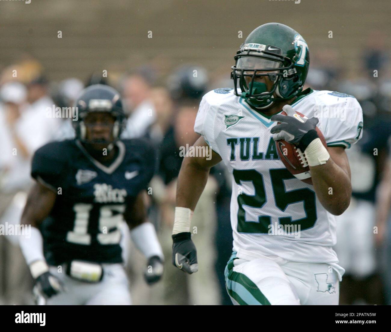 Tulane running back Matt Forte (25) rushes for 46 yards and a touchdown  followed by Rice defender Brandon King (15) in the first half in a college  football game Saturday, Nov. 17,