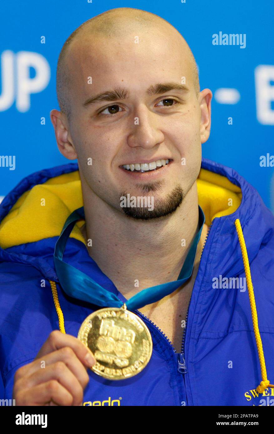 Sweden's swimmer Stefan Nystrand poses with his gold medal during the