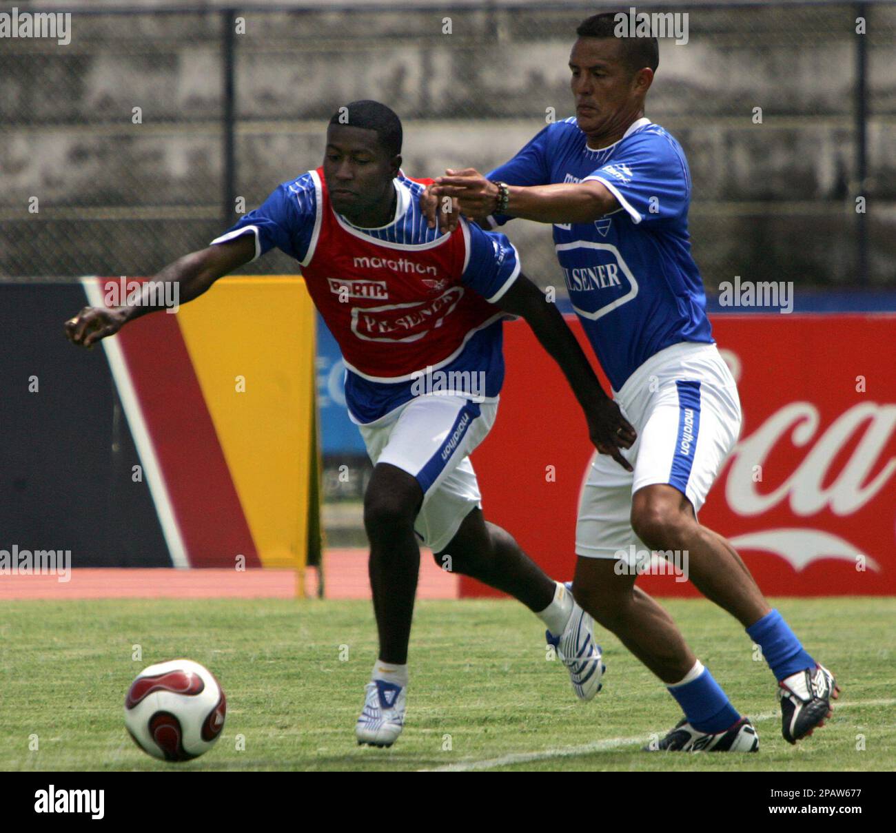 Ecuador's national soccer team players Carlos Castro, right, and Edison Mendez fight for the ball during a training session in Quito, Tuesday, Nov. 13, 2007. Ecuador will face Paraguay in a World Cup 2010 qualifying match in Asuncion next Nov. 17. (AP Photo/Dolores Ochoa) Stock Photo