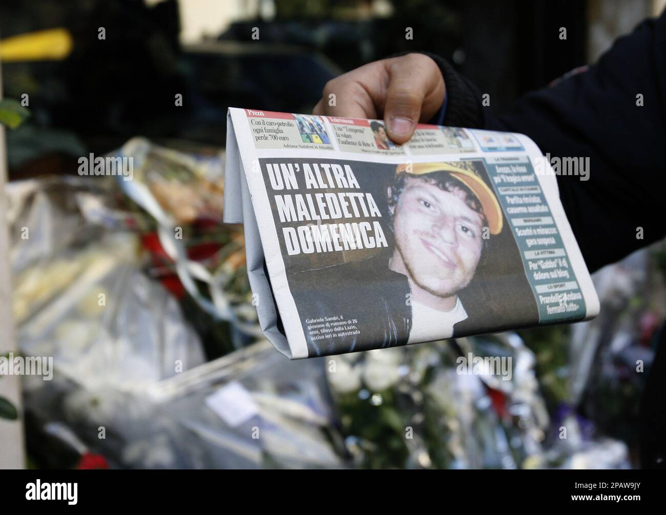 Newspaper In Rome A newspaper front page bearing the picture of Gabriele Sandri and ...
