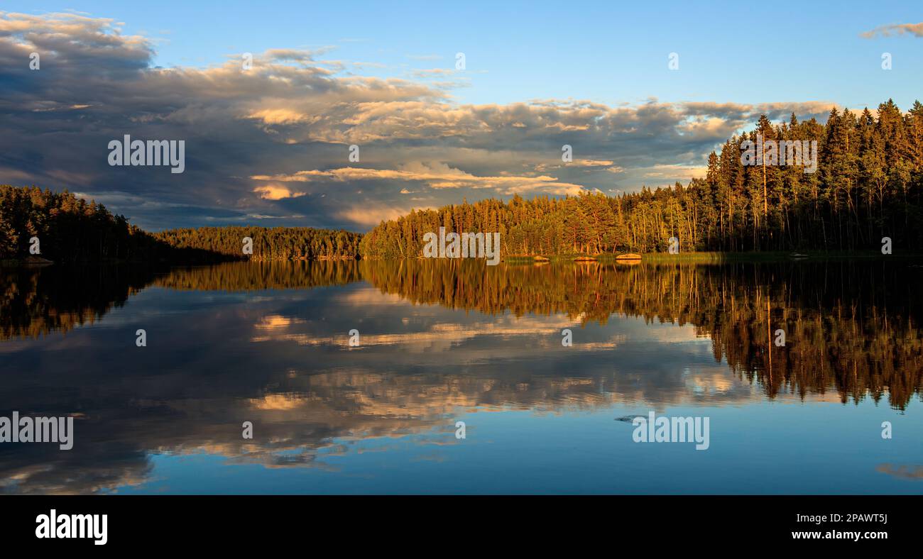 Idyllic panorama landscape of Swedish lake sunset Stock Photo