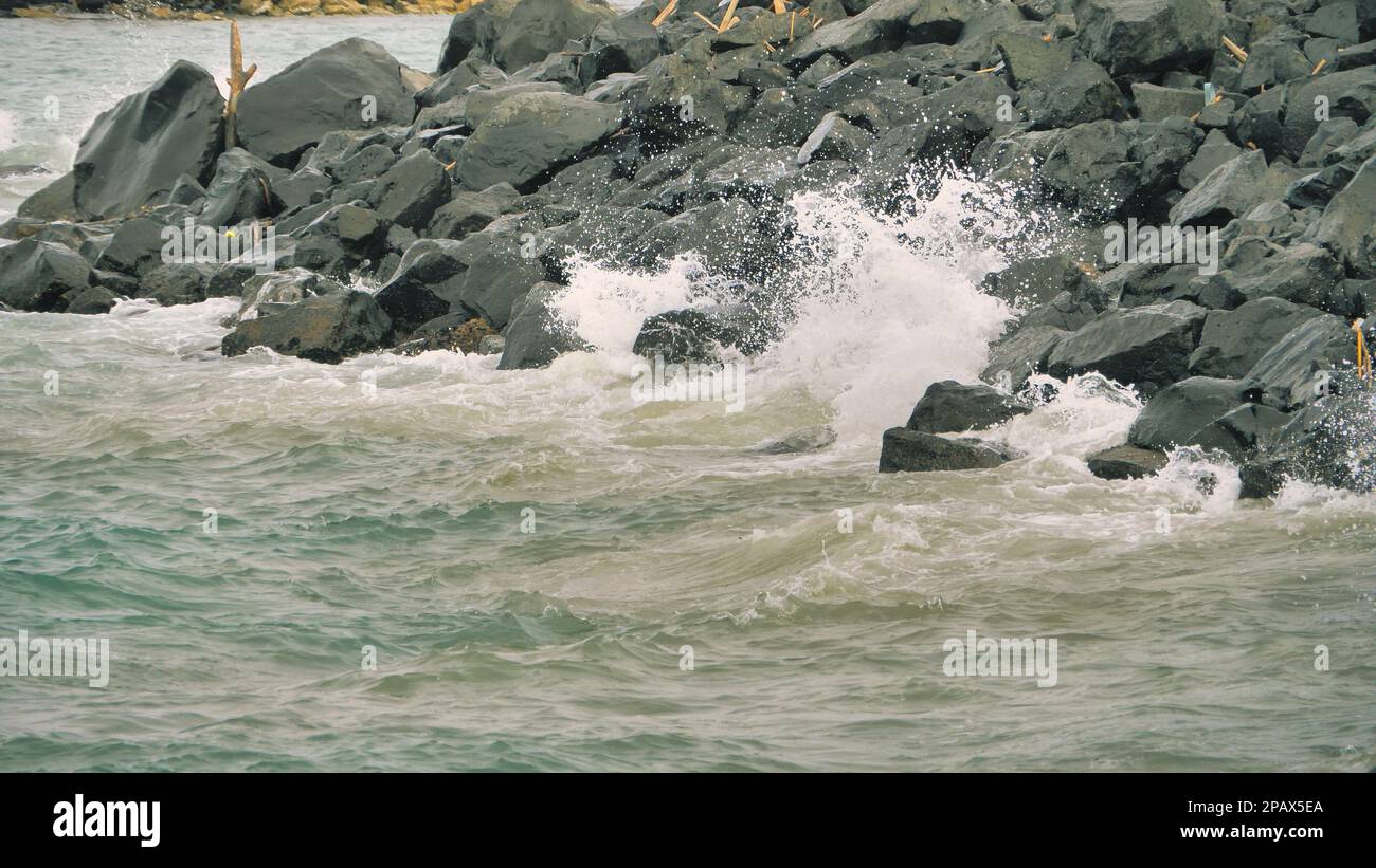 Ocean waves crashing onto a rocky shore Stock Photo - Alamy
