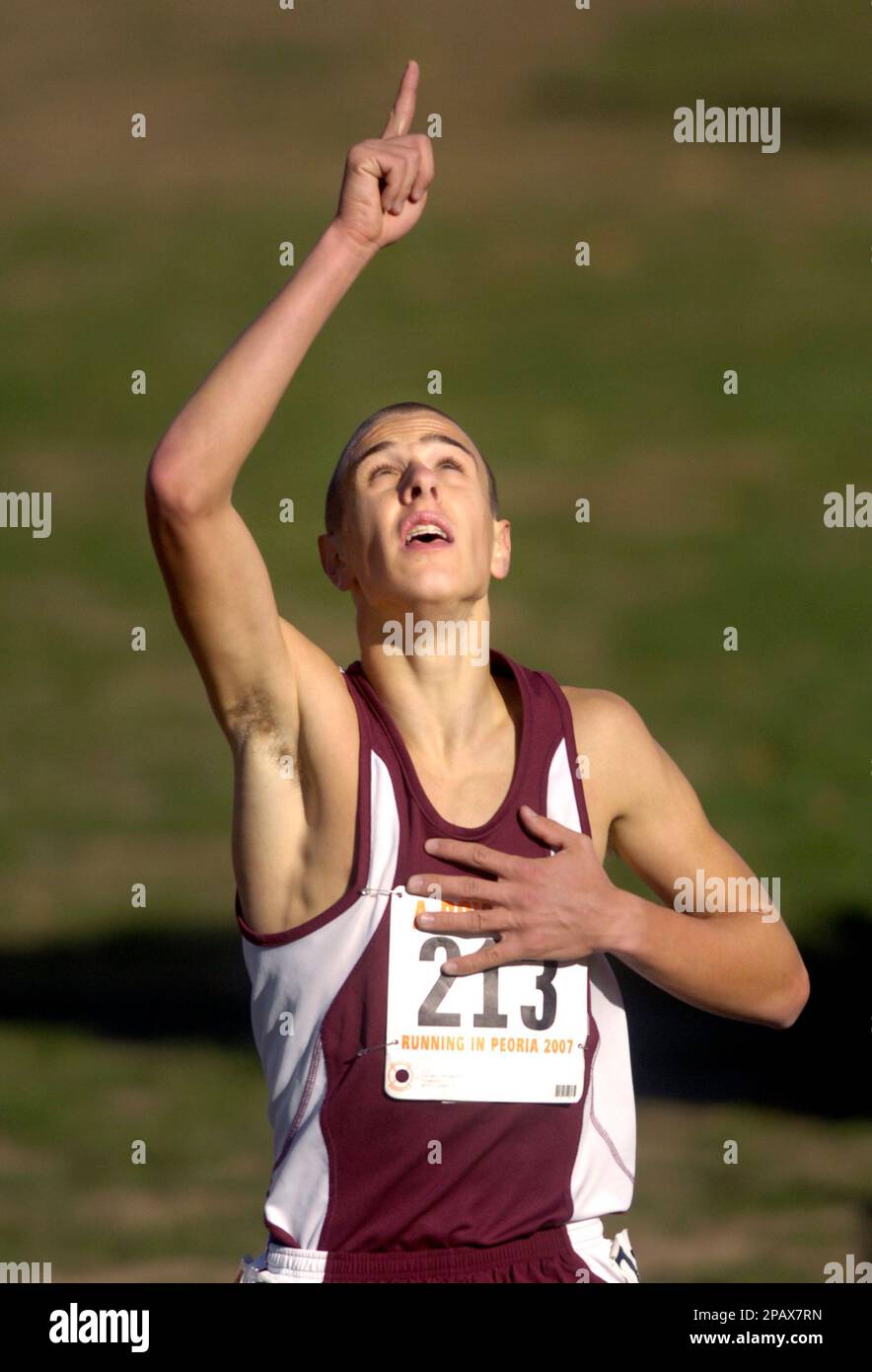 Tremont's Parker Thompson points skyward as he wins the IHSA boys' Class 1A state cross country