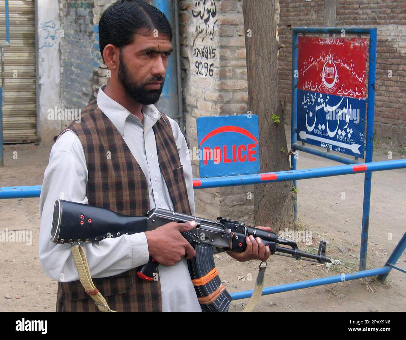 An armed militant supporter of Maulana Fazlullah, a hard line cleric ...