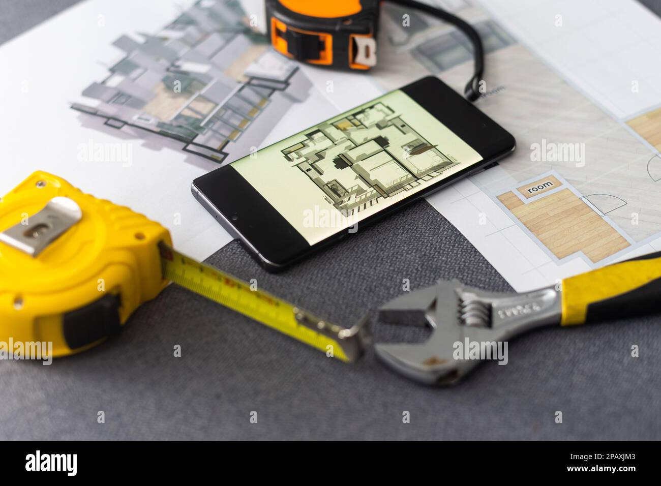 website wireframe sketch and programming code on smartphone Stock Photo