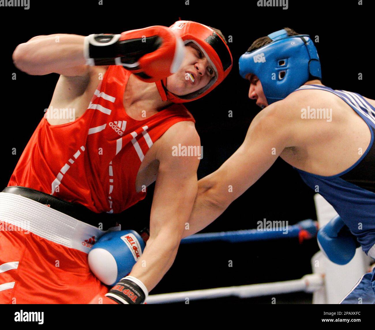 Denys Poyatsyka, left, of Ukraine, works against Eichin Alizade, of  Azerbaijan, during their round-of-16 bout in the 91-kilogram class of the  World Boxing Championships in Chicago, Tuesday, Oct. 30, 2007. Alizade won
