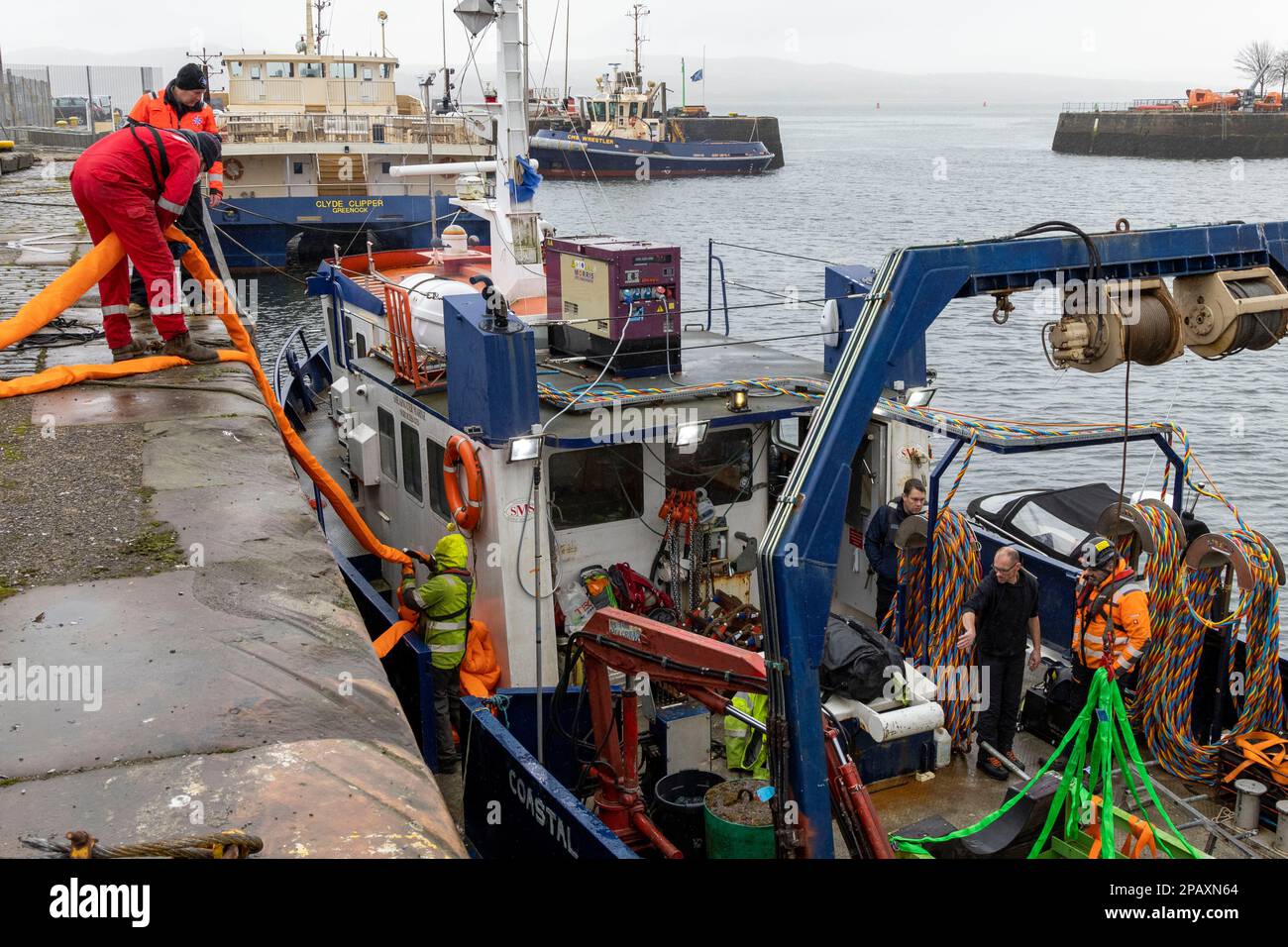 A salvage team prepare their equipment at Victoria Harbour ahead of ...