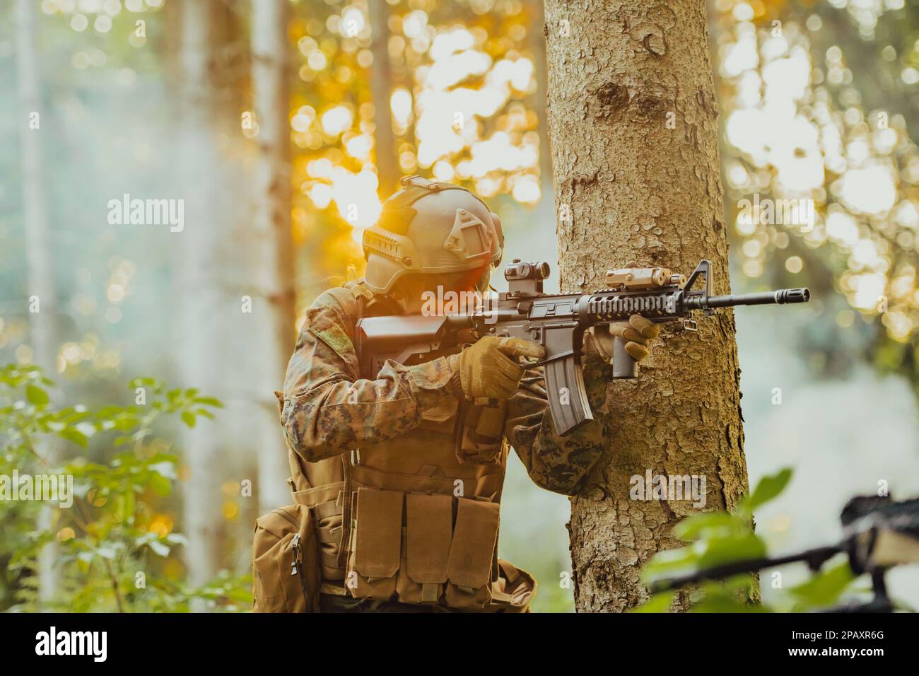 A modern warfare soldier on war duty in dense and dangerous forest ...