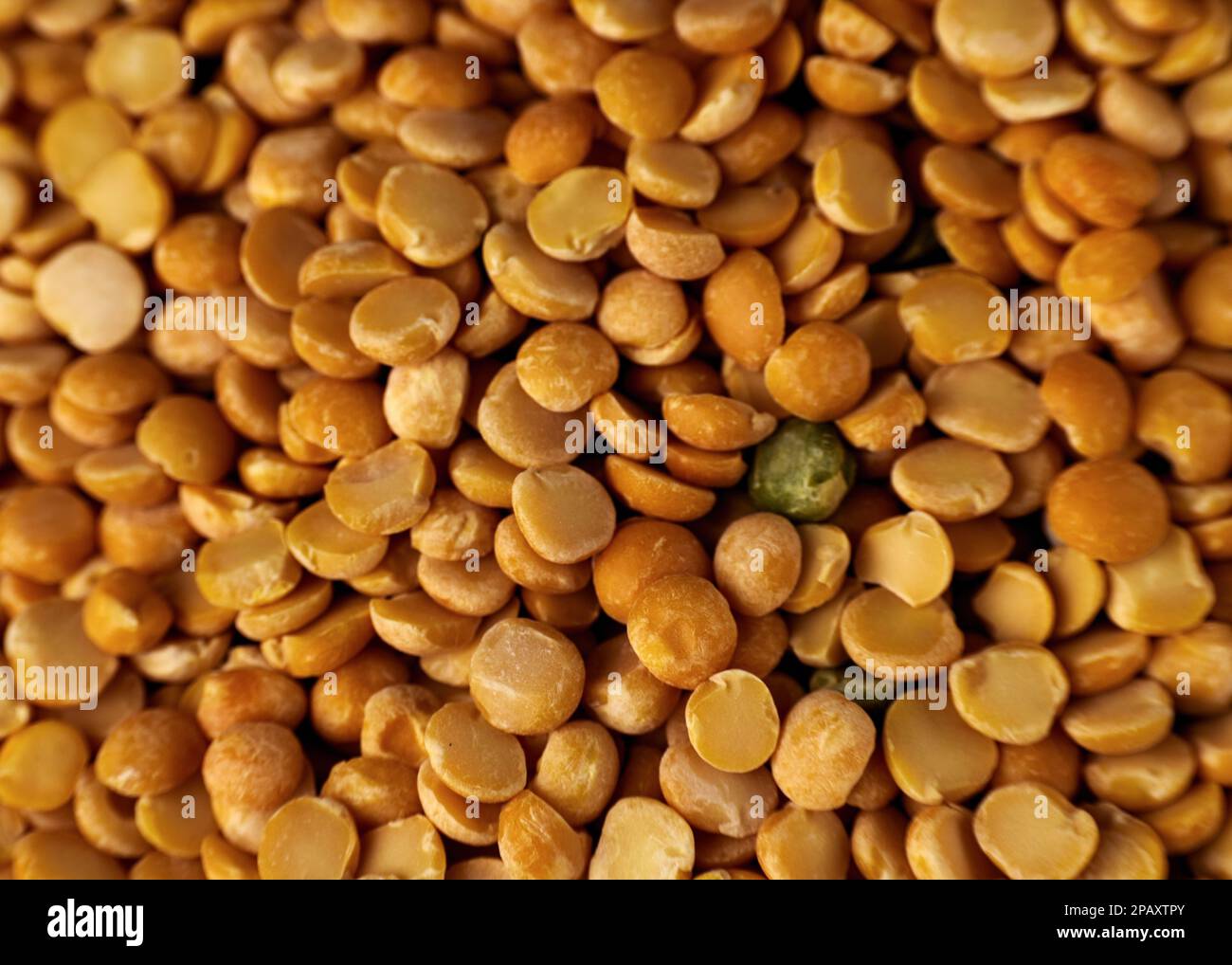 Yellow dry peas background texture. Split dried peas closeup photo Stock Photo