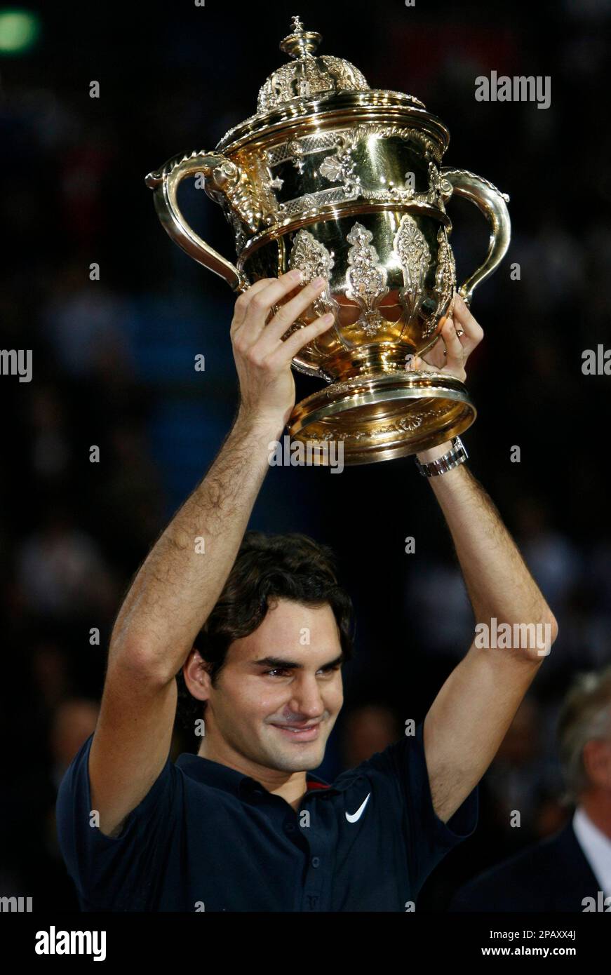 Roger Federer of Switzerland lifts the trophy after winning his final match  against Jarkko Nieminen of Finland at the Davidoff Swiss Indoors in Basel,  Switzerland, Sunday, Oct. 28, 2007. (AP Photo/KEYSTONE/Steffen Schmidt