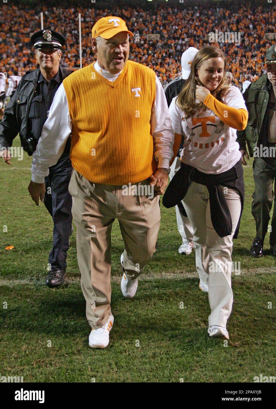 Tennessee coach Phillip Fulmer leaves the field with his daughter Allison after his team defeated South Carolina in overtime 27-24 in a college football game Saturday, Oct. 27, 2007 in Knoxville, Tenn. (