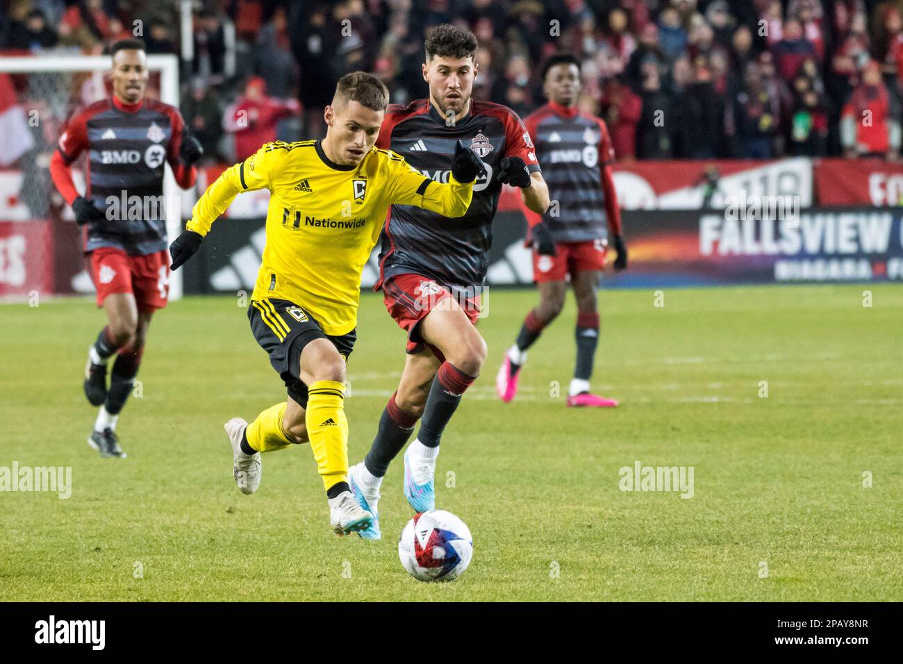 Toronto, Canada. 11th Mar, 2023. Alexandru Matan #20 (L) and Jonathan Osorio #21 (R) seen in action during the MLS game between Toronto FC and Columbus Crew at BMO field in Toronto. Final score; Toronto FC 1:1 Columbus Crew Credit: SOPA Images Limited/Alamy Live News Stock Photo