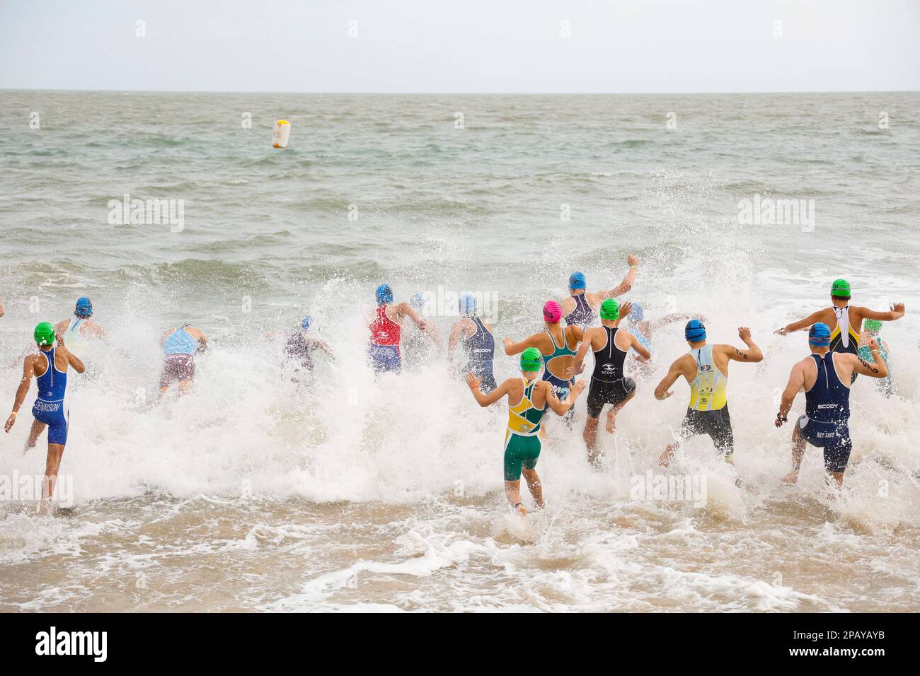 Running start of the swimming competition at the  National Schools Triathlon in Hervey Bay, Torquay, Queensland, Australia Stock Photo