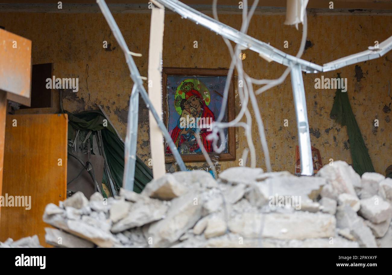 A view shows an icon knit inside a house destroyed in recent shelling in the course of Russia-Ukraine conflict in Donetsk, Russian-controlled Ukraine, March 12, 2023. REUTERS/Alexander Ermochenko Stock Photo