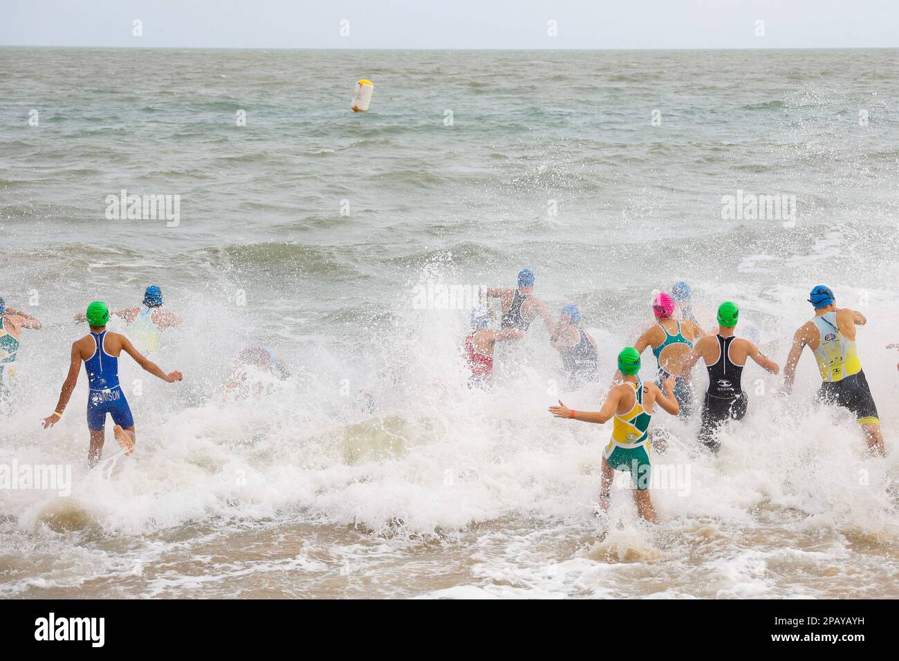 Running start of the swimming competition at the  National Schools Triathlon in Hervey Bay, Torquay, Queensland, Australia Stock Photo