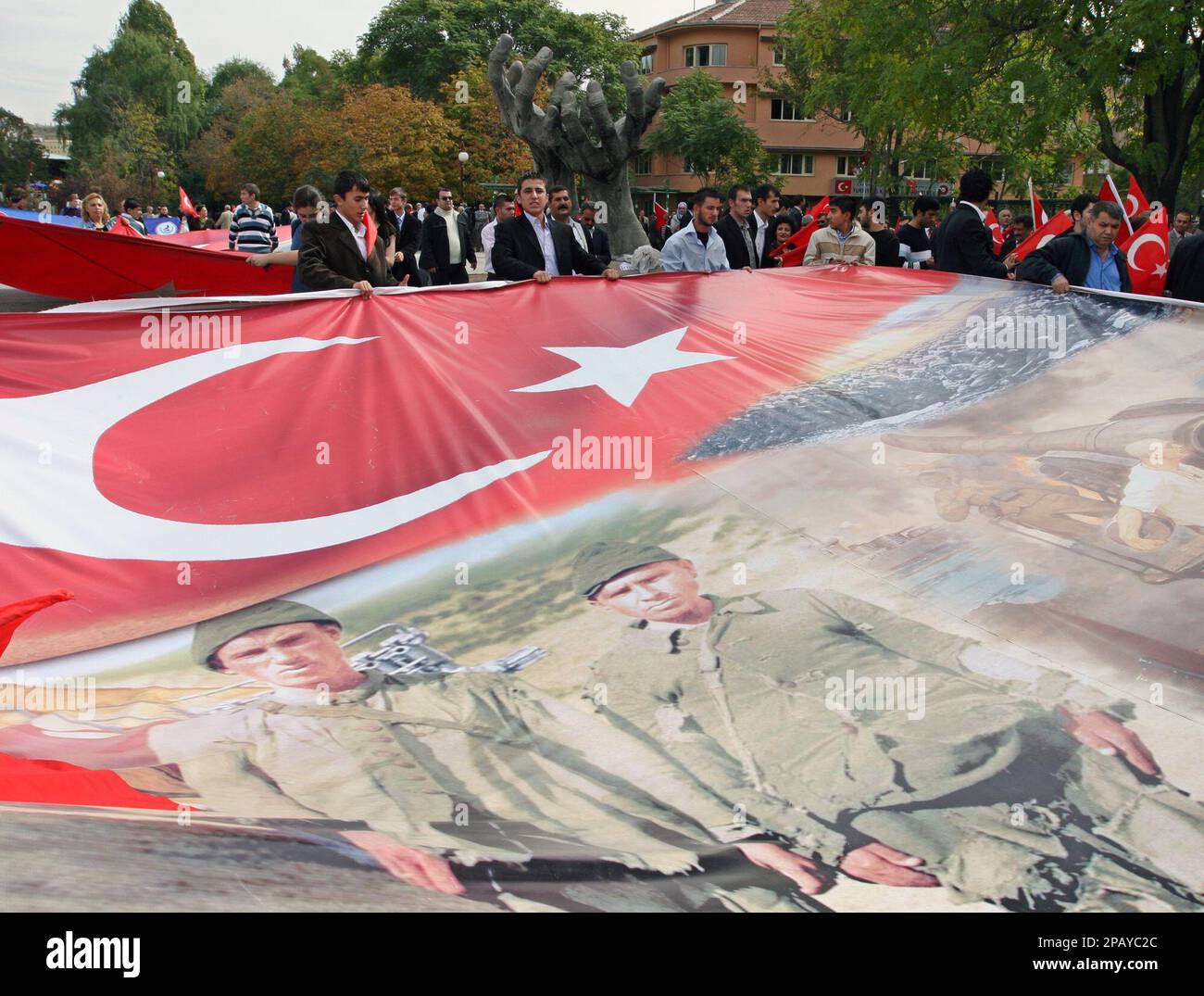 Turkish University Students Hold A Poster Of Two Turkish Child-soldiers ...