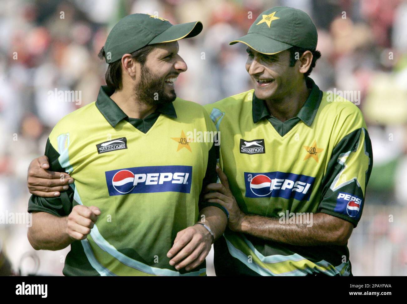 Pakistan's pacer Rao Iftikhar, right, shares a joke with teammate ...