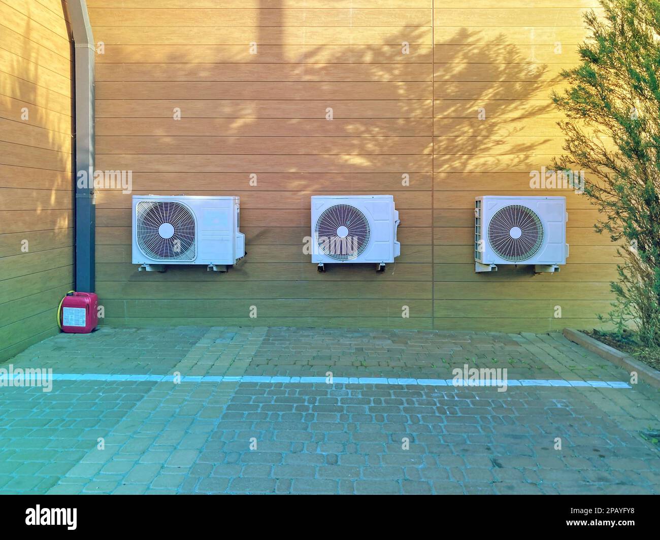 Three air conditioners fixed on the wall of the building. Closeup of