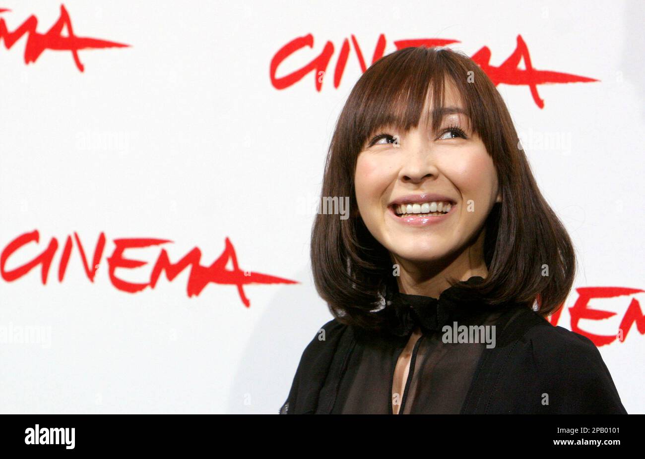 Japanese actress Kumiko Aso poses for photographers during the