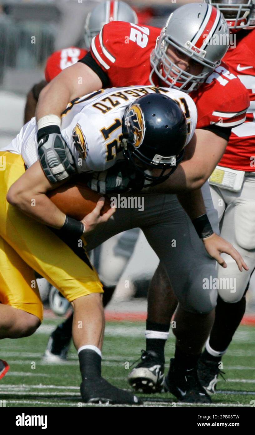 Ohio State defensive tackle Dexter Larimore (72) sacks Kent State quarterback Anthony Magazu (12