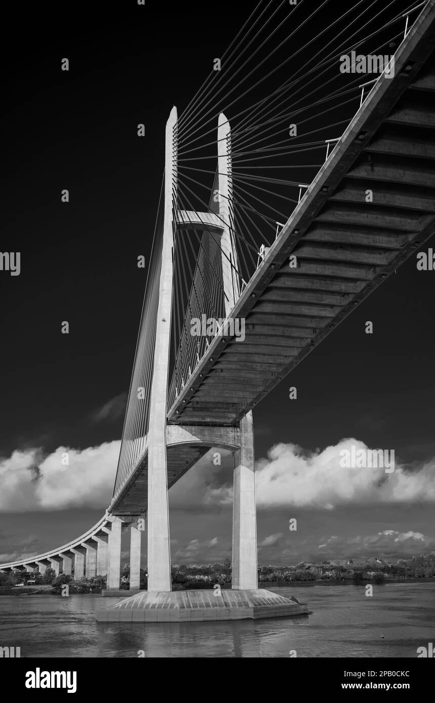 Passing under the Tsubasa Bridge across the Mekong River in Kandal Province, Cambodia. Stock Photo