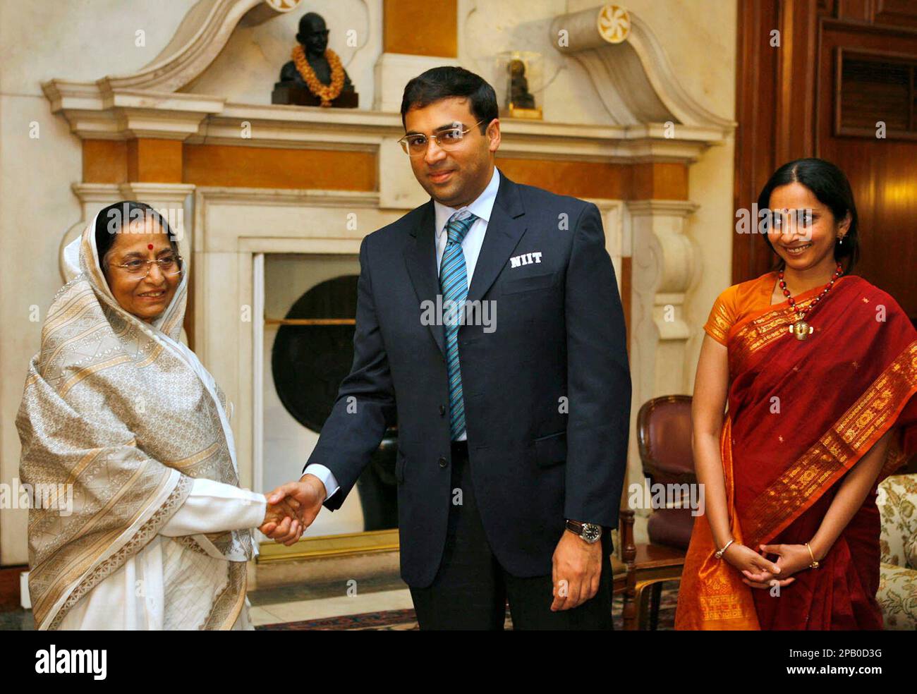 Aruna Anand, wife of Indian chess grandmaster Viswanathan Anand, right,  gives him a piece of cake during her birthday celebrations in Gauhati,  India, Thursday, June 30, 2005. (AP Photo/Anupam Nath Stock Photo 