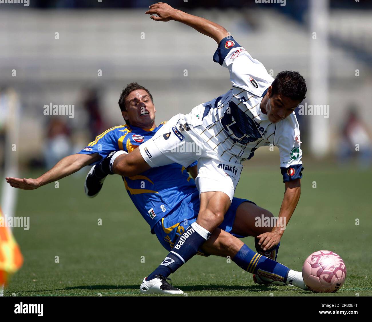 Pumas's Pablo Barrera, front, battles for the ball with Tigres' Lucas Ayala during their Mexican soccer league match in Mexico City, 14, 2007. Pumas 3-0.( AP Photo/ Claudio
