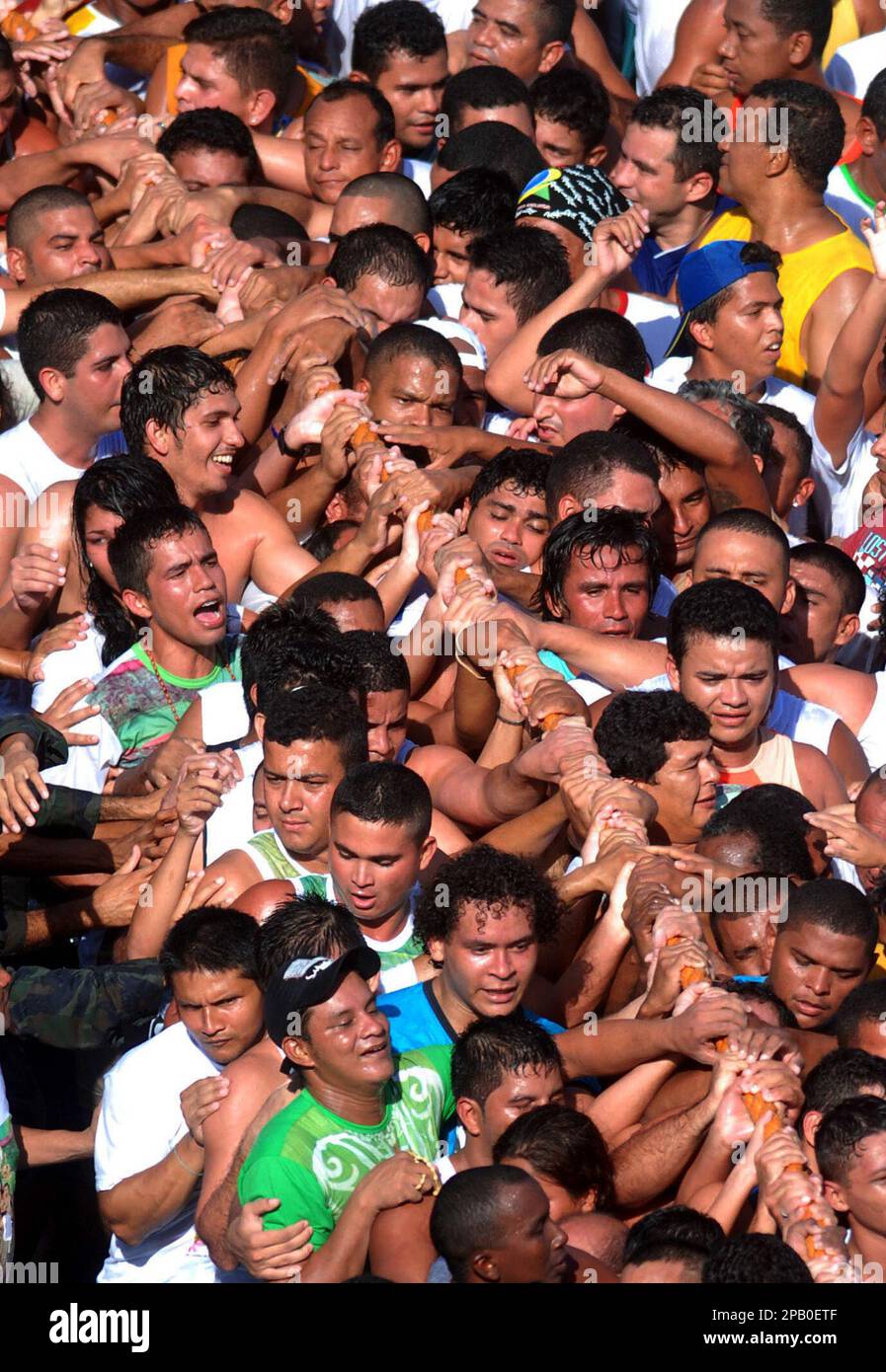 Worshippers pull the rope which is attached to the image of