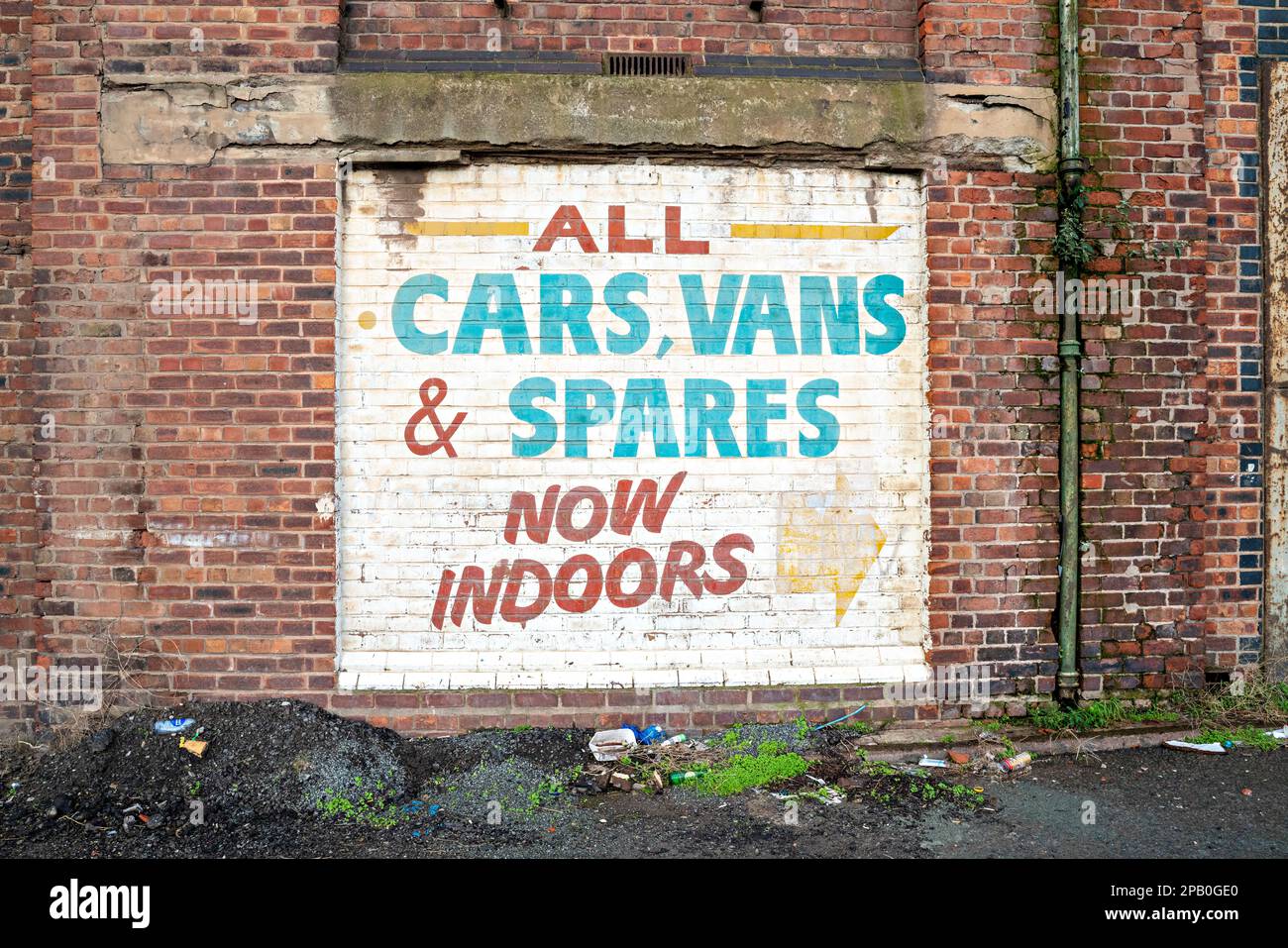 Painted Car Sales advertisement on warehouse wall Stock Photo