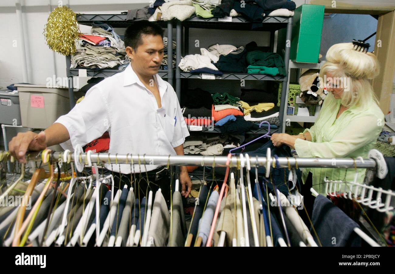 Van Tin Lian Zathang, left, and Kelly Ellington look for clothes 