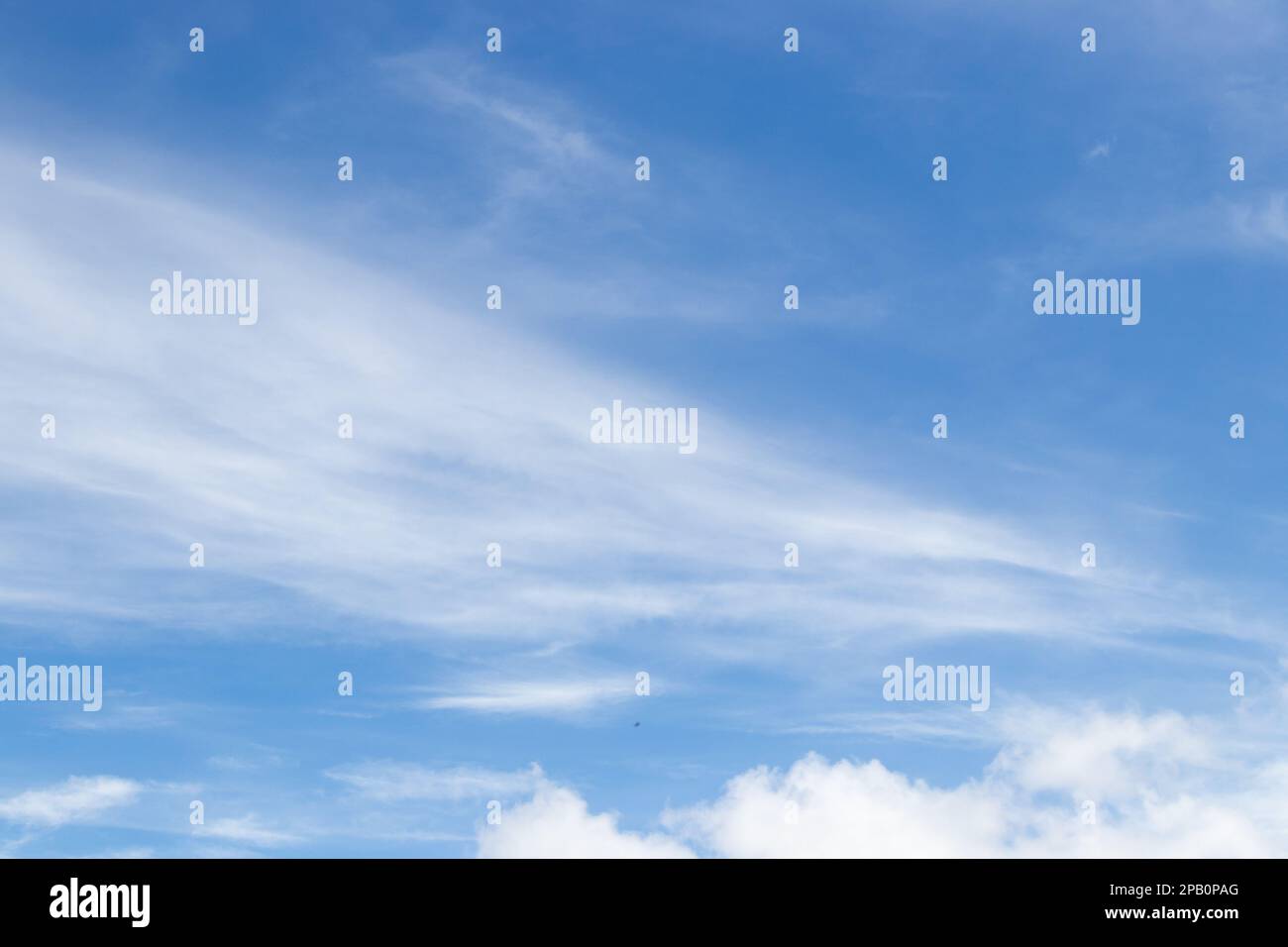 Blue color sky with white fluffy cloud background Stock Photo - Alamy