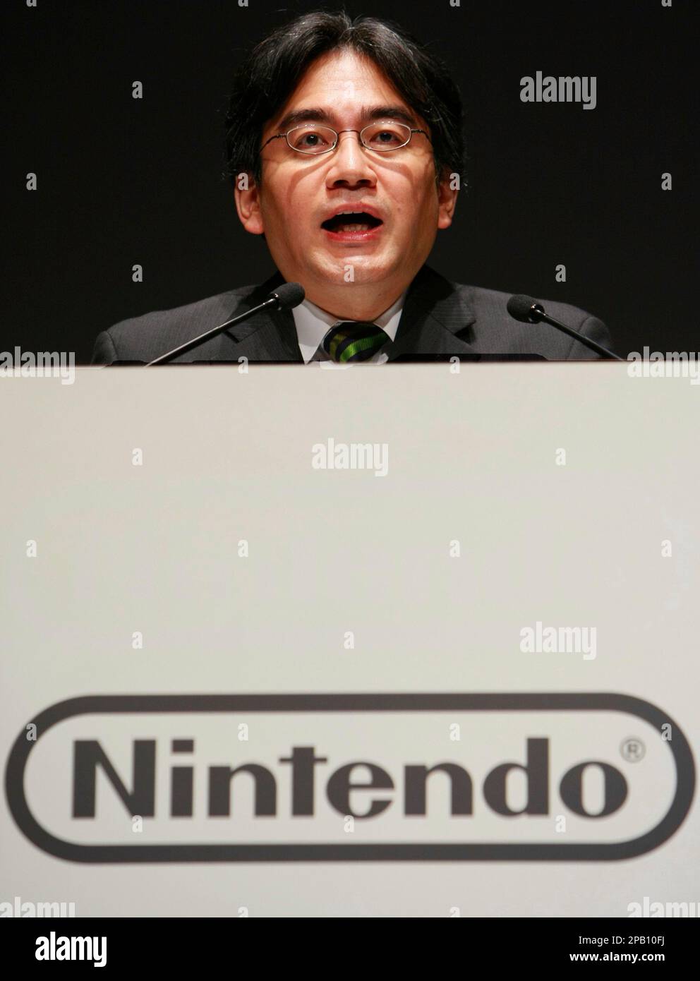 Nintendo President Satoru Iwata speaks as he unveils a Nintendo