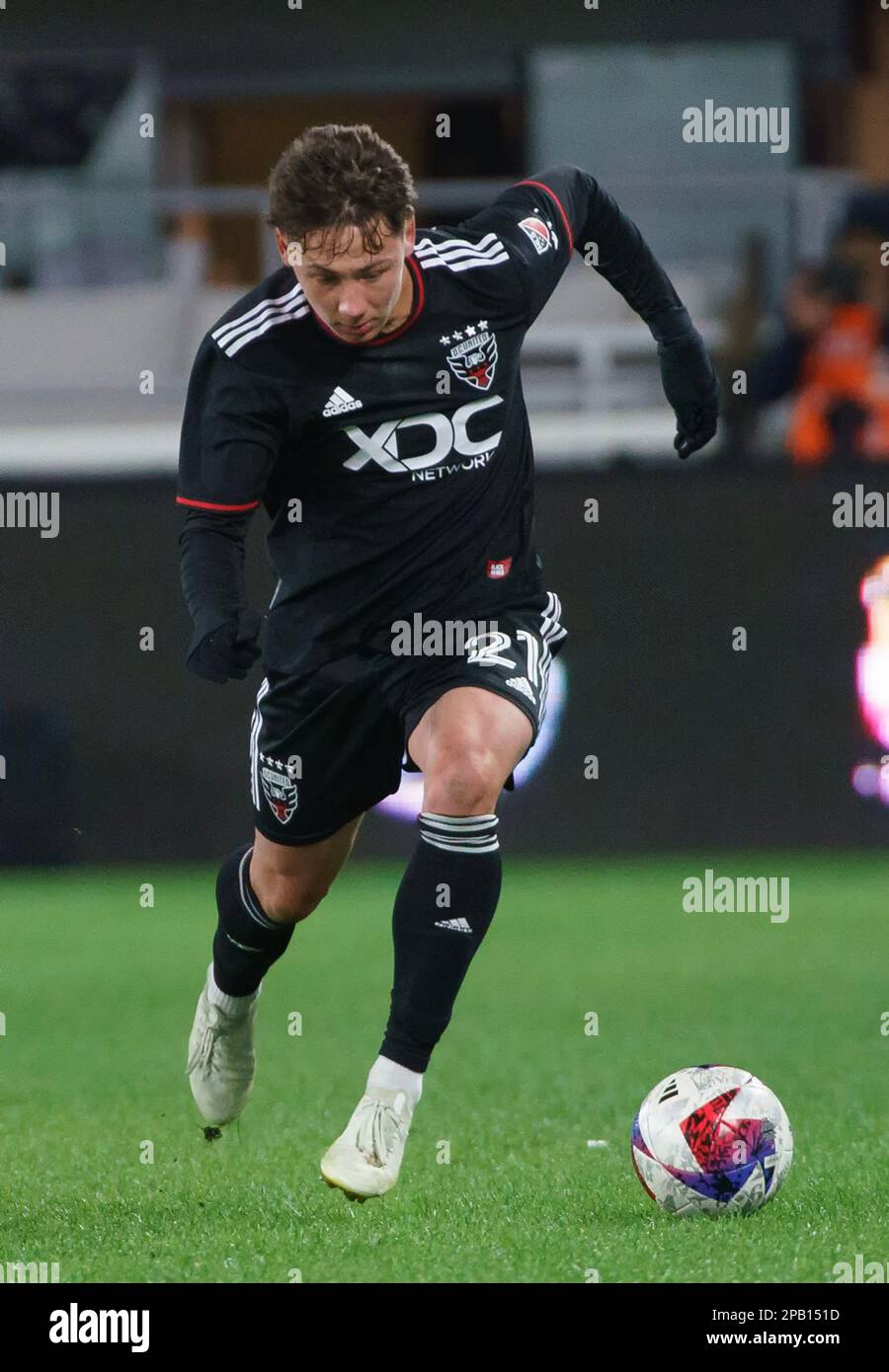 WASHINGTON, DC, USA - 11 MARCH 2023: DC United midfielder Theodore Ku-Dipietro (21) moves into the attack during a MLS match between D.C United and Orlando City SC, on  March 11, 2023, at Audi Field, in Washington, DC. (Photo by Tony Quinn-Alamy Live News) Stock Photo