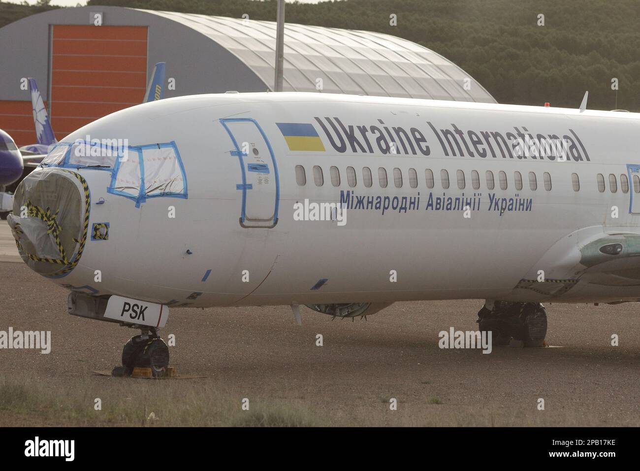 Castellon de la Plana, Spain - November 11, 2022: Ukraine International Airlines (Miznarodni Avialiniji Ukrajiny) airplane fuselage on a planes cemete Stock Photo