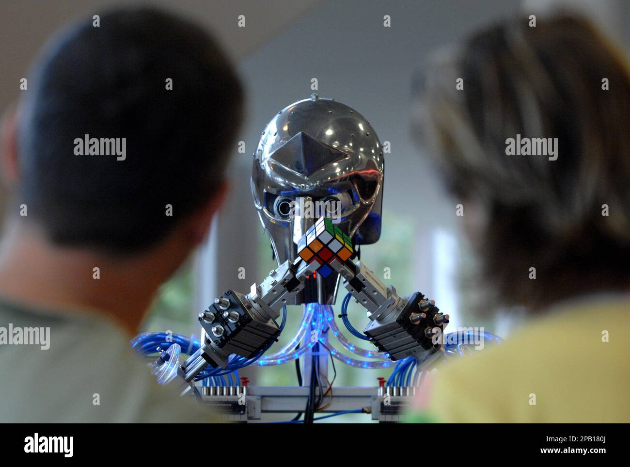 People watch a robot, called 