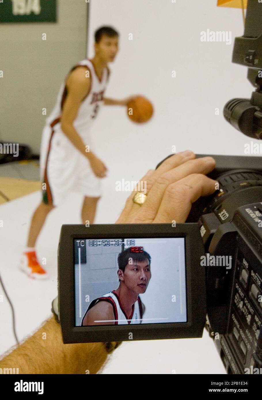 Milwaukee Bucks' Yi Jianlian of China is seen on a video camera as he ...