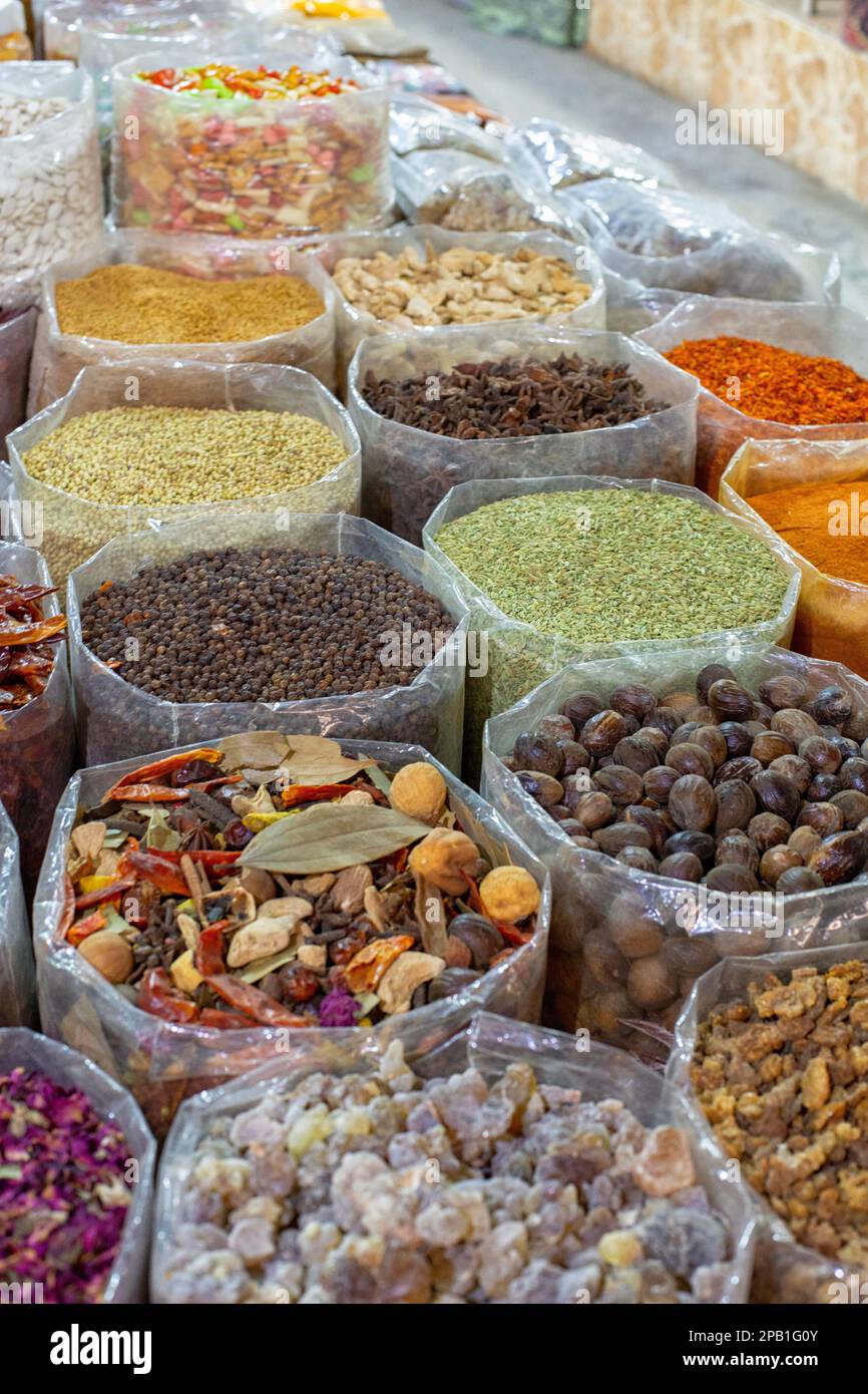 Bags filled with herbs, flavours and nuts at the souk in Muscat, Oman Stock Photo
