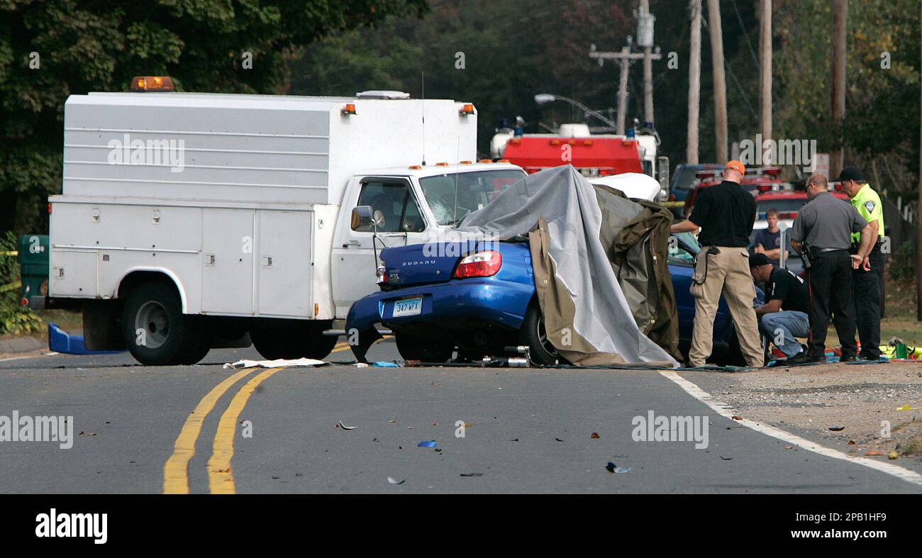 Accident investigators inspect the scene of a fatal accident on Rte. 322 in Wolcott, Conn.,Thursday morning Oct. 4, 2007. Three Wolcott High School students were killed the a car crash, police said.