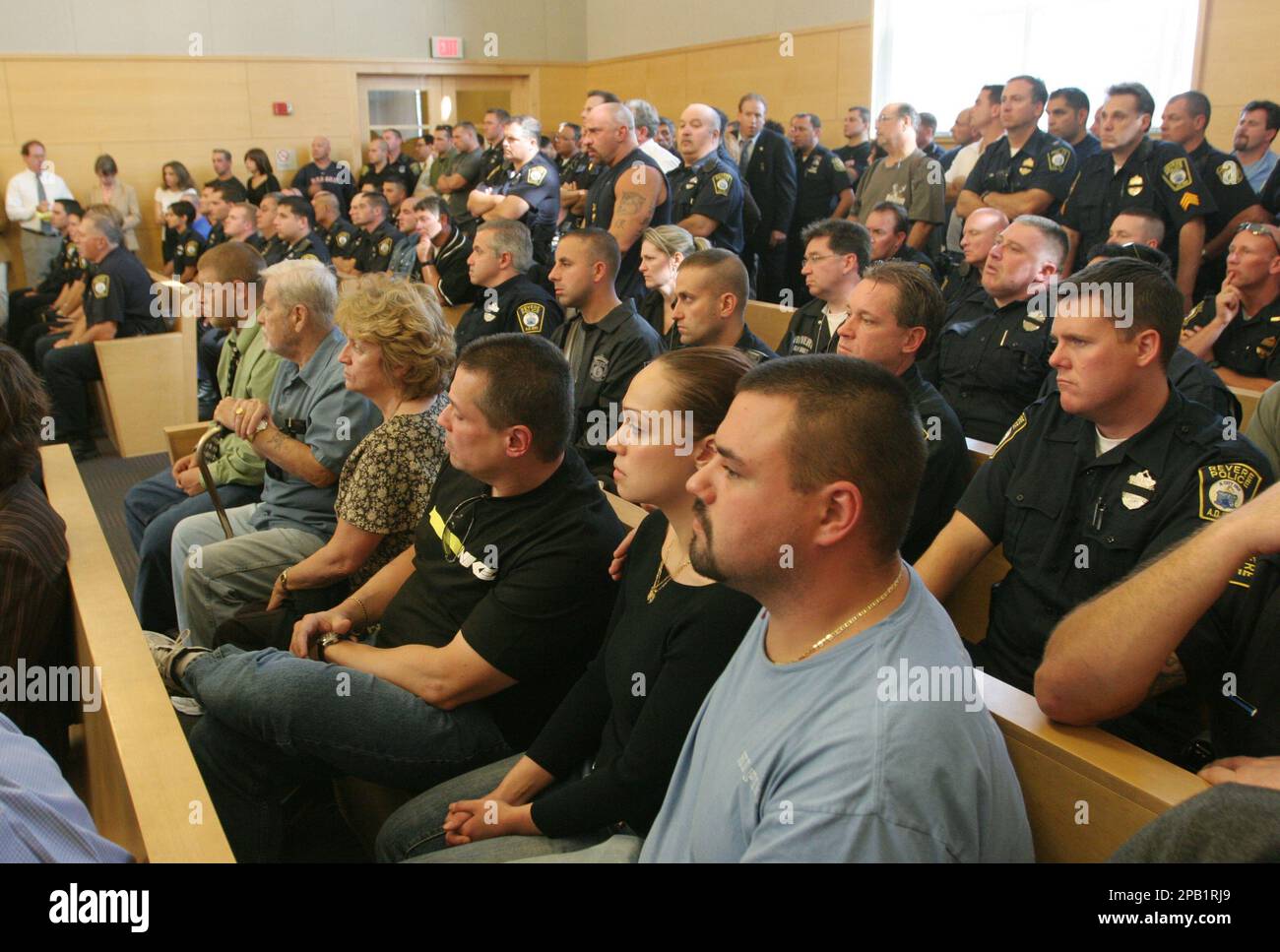 Revere police officers listen to the arraignment Tuesday, Oct. 2, 2007