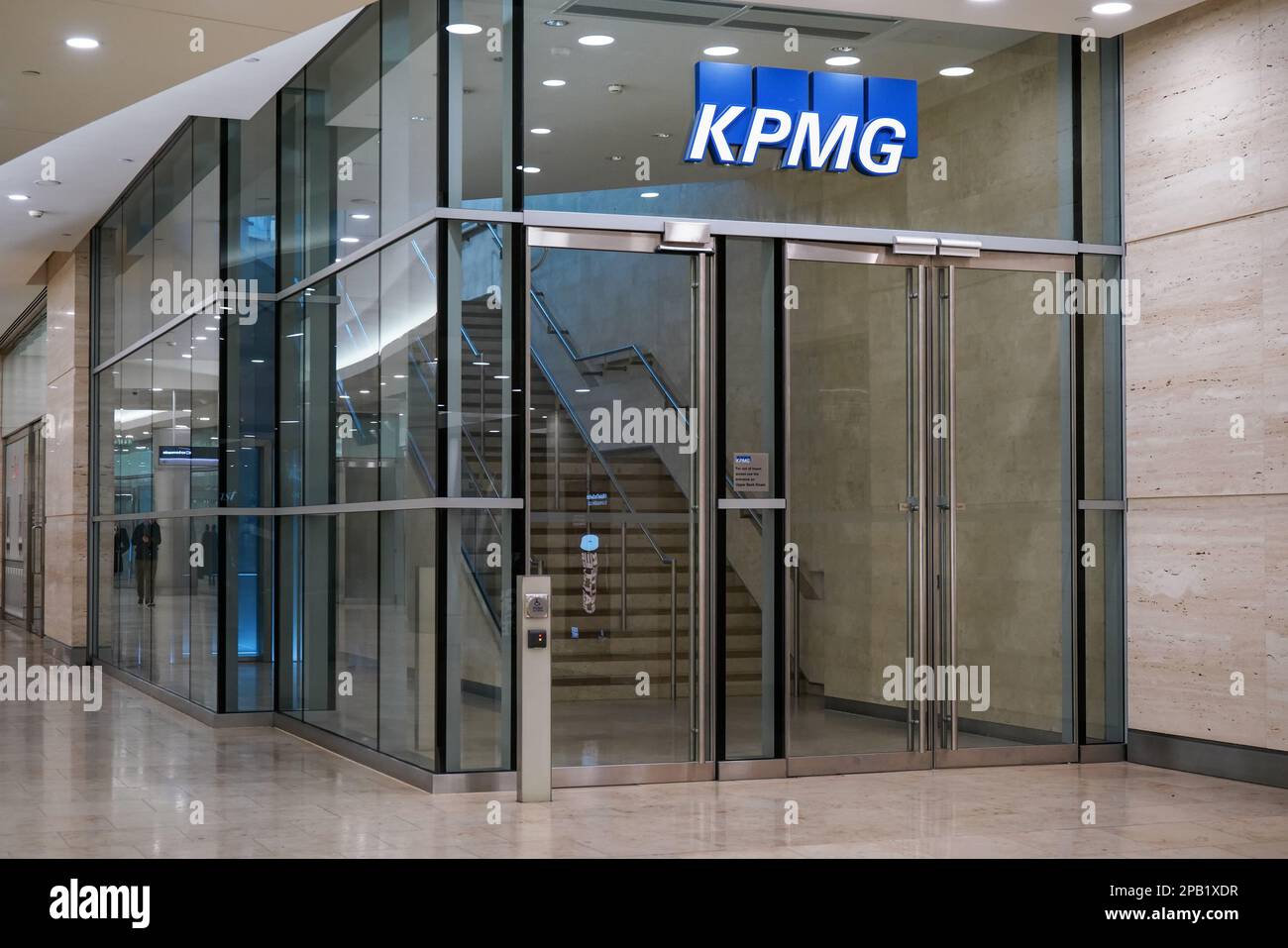 London, United Kingdom - February 03, 2019: Blue KPMG signage at entrance to their offices on 15 Canada Square in Canary Wharf - headquarters of compa Stock Photo